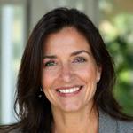 Marta García, cofundadora y especialista en nutrición holística, sonriendo amistosamente